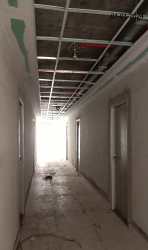 Hostel Block H4 (Internal)–Tile work in progress.  Electrical fitting installation work in progress.